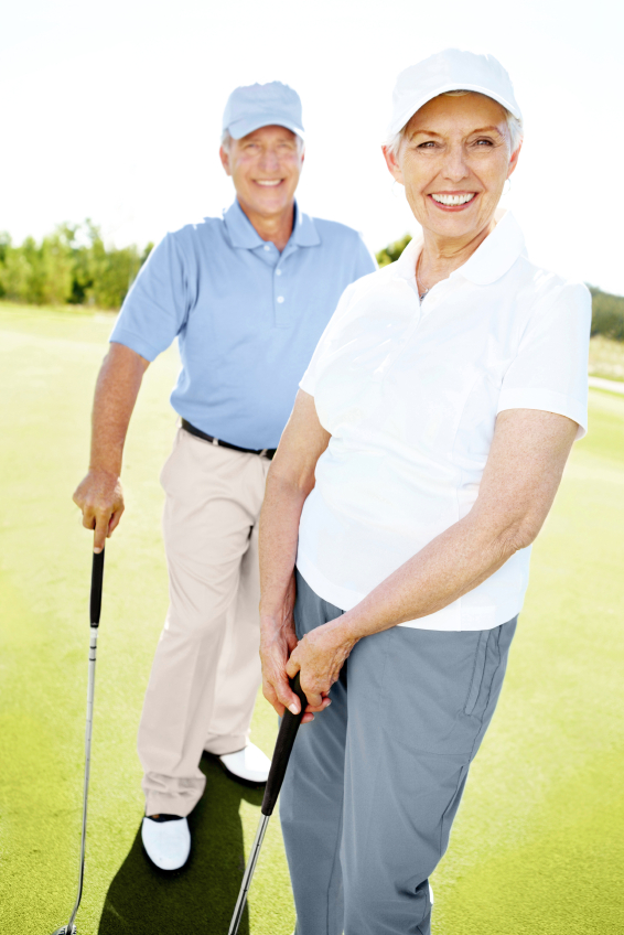 Portrait of a couple standing together on a golf course
